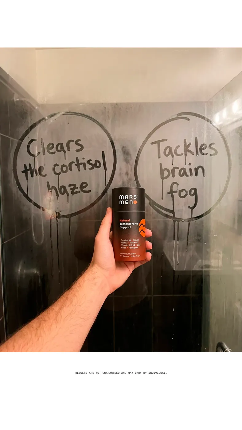 Hand holding product in steamy shower with handwritten text